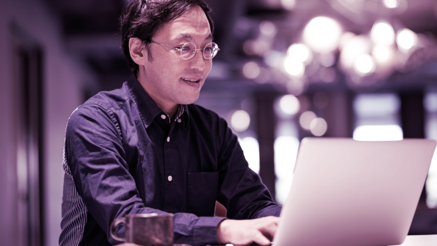 Happy-man-in-coffeehouse-with-laptop-Crocus-Thumbnail.png